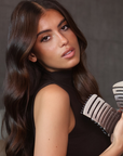 Model using both the ZIGZAG Brush and ZIGZAG Travel Hair Brush for detangling, smoothing, and frizz-free results.