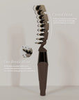 ZIGZAG Brush with curved head for scalp stimulation and blood flow, featuring 93 rounded nylon pins and cruelty-free boar bristle blend.