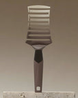 Back view of the ZIGZAG Brush highlighting the flexible zigzag frame and ergonomic design for healthy hair brushing.