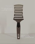 Close-up of ZIGZAG Brush effortlessly detangling hair with no pulling, tugging, tension, or breakage.