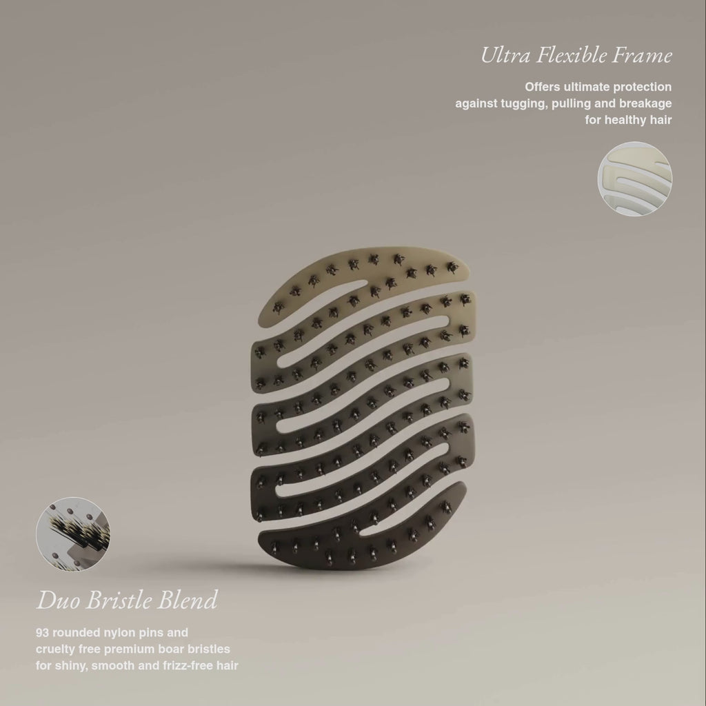 ZIGZAG Travel Hair Brush rotating to reveal ultra-flexible frame and duo bristle blend with combination of nylon pins and boar bristles for no pulling or breakage